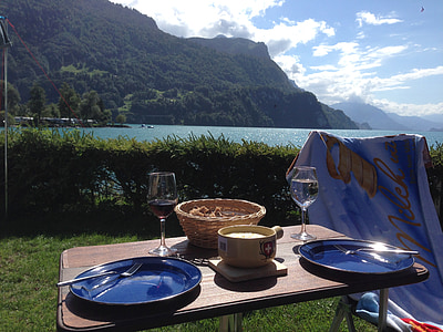 dinnerware on table near bushes thumbnail