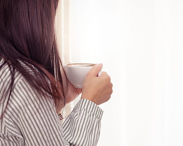 Photo of Woman Holding Cup of Coffee thumbnail