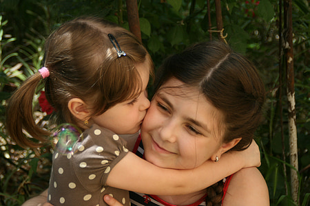 toddler hugging girl thumbnail