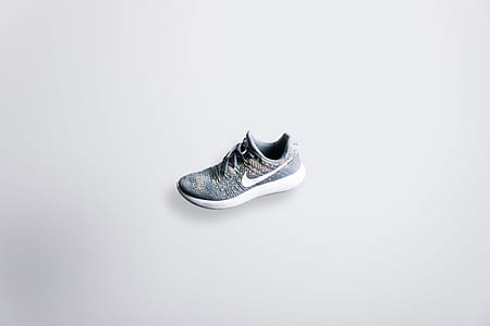 grey and white Nike athletic shoe thumbnail