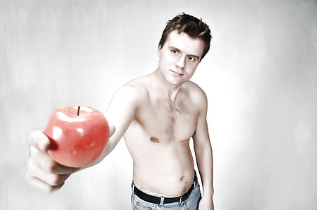 man holding red apple using his right hand thumbnail