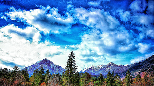 snow-cap mountains and pine trees under cloudy sky painting thumbnail