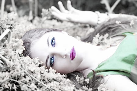 woman lying on flower bed thumbnail