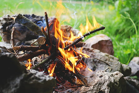 close-up photography of fire on gray stone thumbnail