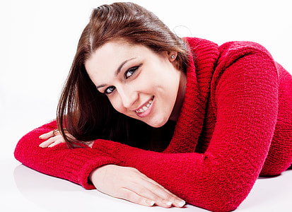 laying woman wearing red sweatshirt thumbnail