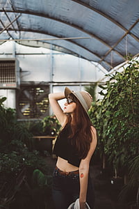 woman wearing crop top surrounded by plants thumbnail