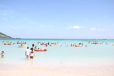 people on ocean under blue sky thumbnail