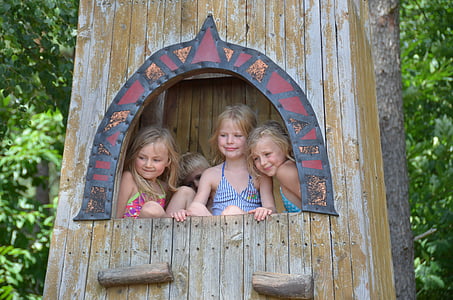 four children inside shed near trees thumbnail