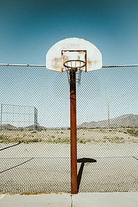portable basketball near chain link fence thumbnail