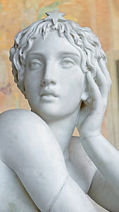 shallow focus photography of statue of woman thumbnail