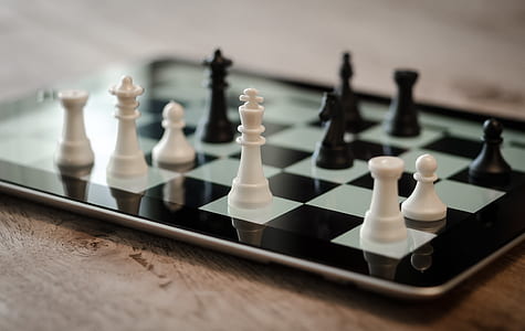 Tilt Shift Lens Photo of Black and White Chess Pieces thumbnail