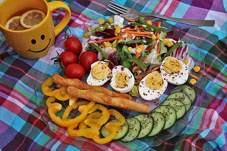 egg Benedict with sliced bell pepper, zucchini, and cherry tomatoes thumbnail