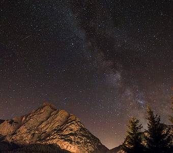 photography of mountain, trees and stars thumbnail