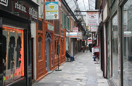 man sitting beside building thumbnail