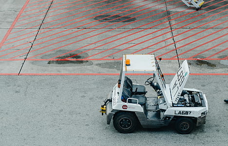 White Black La687 Mini Toy Car on Parking Lot thumbnail