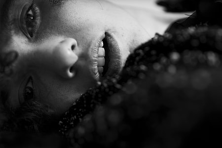 grayscale photo of woman in front of the camera thumbnail