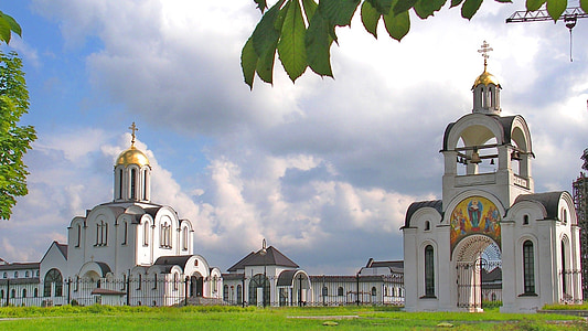 photography of two white concrete castles under white clouds at daytime thumbnail