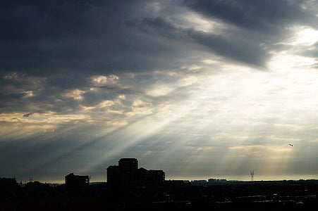 silhouette on cityscape during golden hour thumbnail
