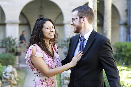 woman smiling holding man's chest thumbnail