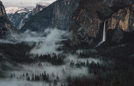 waterfalls near forest during daytime thumbnail