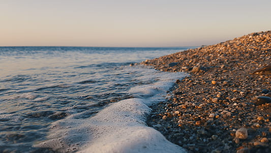 close-up photography of body water beside brown soil during daytime thumbnail