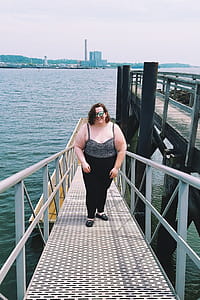 Woman Standing on Bridge thumbnail