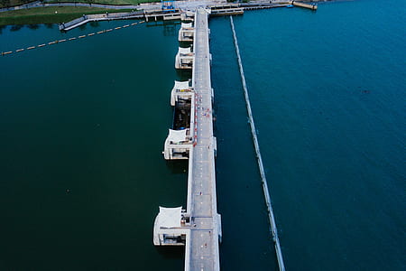 aerial view of bridge over body of water thumbnail
