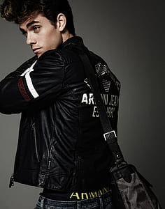 man wearing black leather jacket and bag thumbnail