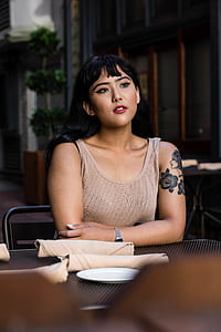woman wearing brown tank top thumbnail