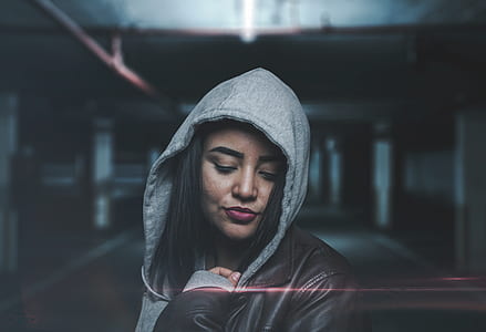 selective focus photo of woman wearing gray hoodie thumbnail