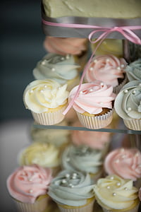 selective focus photography of cupcakes on glass shelf thumbnail