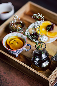 Room service tray at hotel for breakfast: cookies, jam, chocolate mousse, orange fruit, tea thumbnail