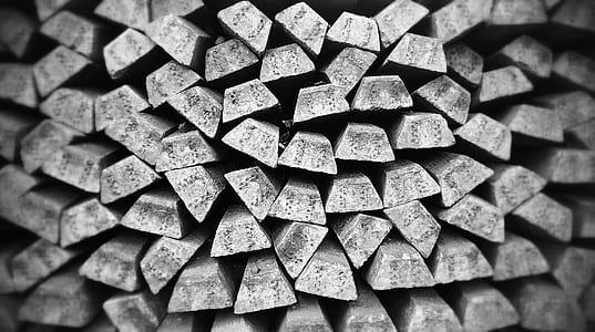 grayscale photo of pile of wooden plank lot thumbnail