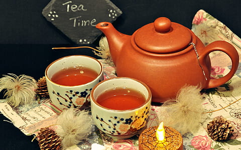 closeup photo of brown teapot with teacup with teas thumbnail
