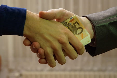 person handing over banknote thumbnail