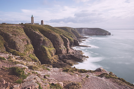 lighthouse near body of water thumbnail
