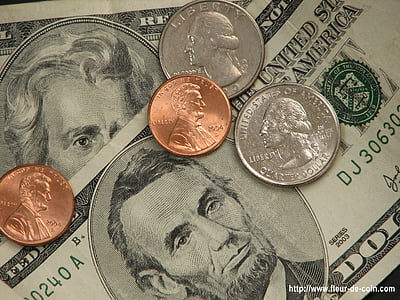 four assorted coins and two banknotes thumbnail