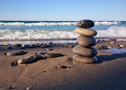 photo of five stacked stones on the beach thumbnail