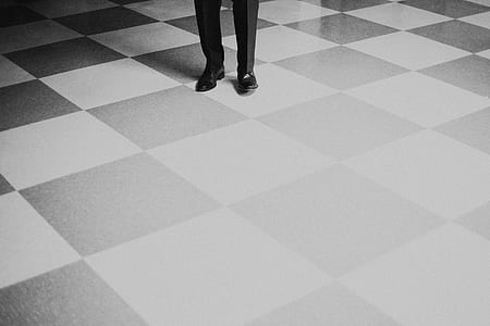 person standing on tiled floor thumbnail