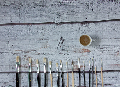 white coffee cup with white and black paint brushes thumbnail