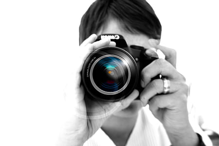 closeup photo of person holding camera thumbnail