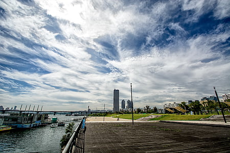 buildings beside body of water during daytime thumbnail