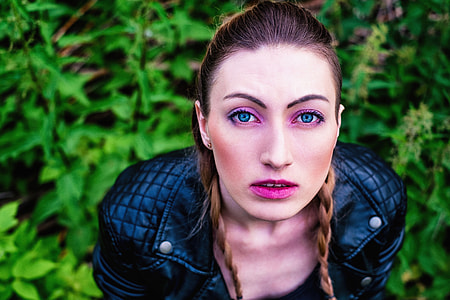 high-angle photography of woman wearing quilted black leather zip-up jacket thumbnail