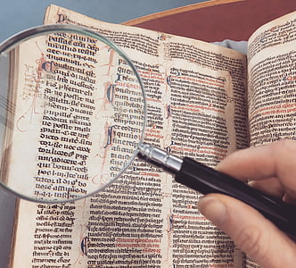 person holding magnifying glass thumbnail