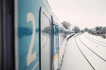 selective focus photography of green train during winter thumbnail