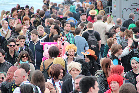crowd people beside body of water at daytime thumbnail