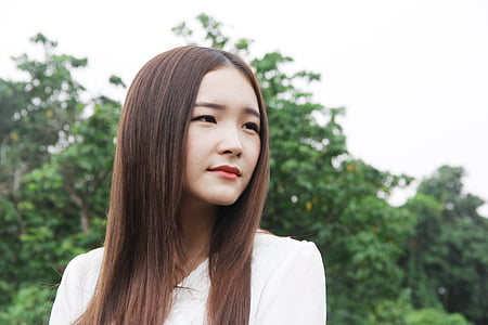 woman wearing white long-sleeved top thumbnail