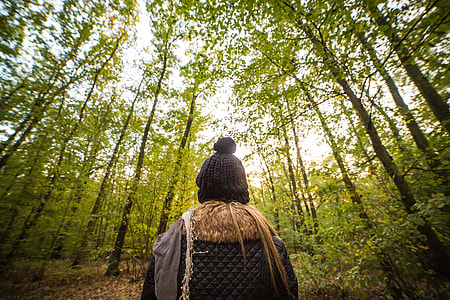 Young Woman Walking Through The Forest thumbnail