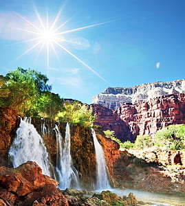 low angle photography of waterfalls thumbnail