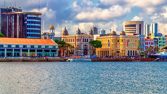 landscape photography of city near riverbanks thumbnail